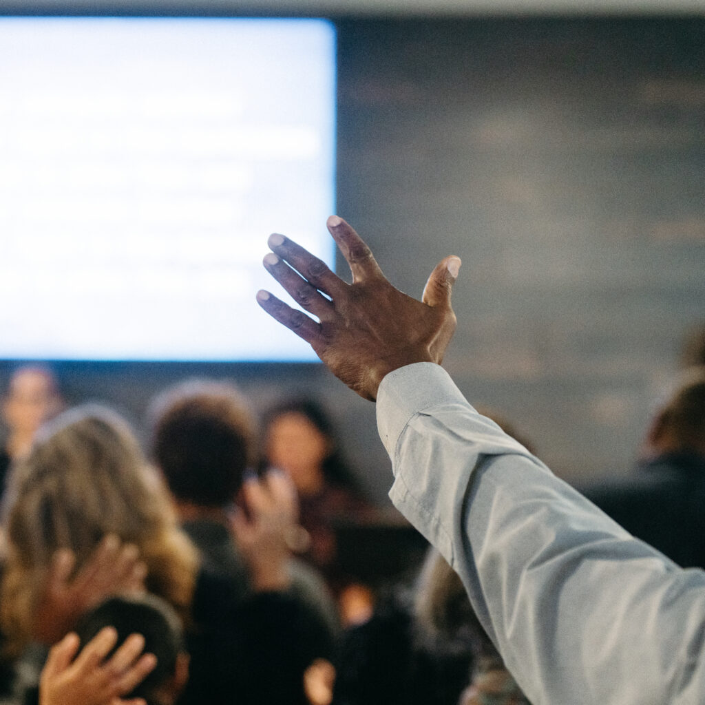Hands lifted in worship at multicultural church in Abbotsford BC