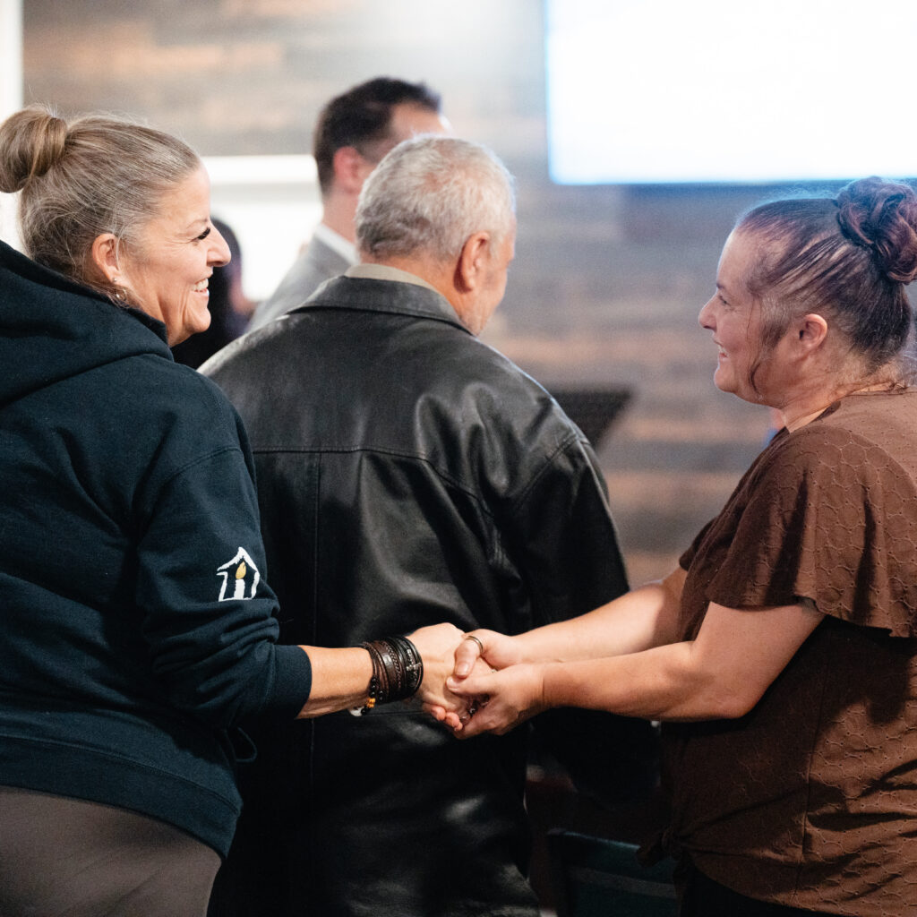 New Life Pentecostal Church Members Greeting Each Other