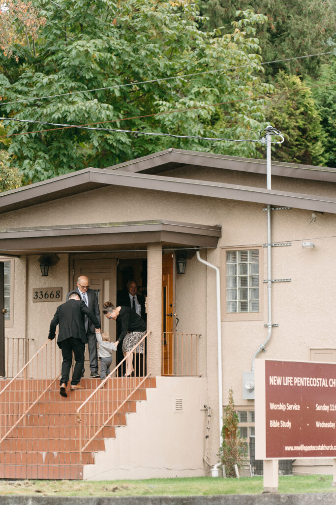 Pastors at New Life Pentecostal Church in Abbotsford welcoming a multigenerational family